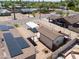 Aerial view of a residence with solar panels, a carport, and a shed at 1109 N Walnut Dr, Casa Grande, AZ 85122