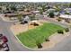 Community aerial view of playground with green grass at 1109 N Walnut Dr, Casa Grande, AZ 85122