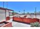 Open backyard with garden beds and covered carport offers versatile outdoor space and parking at 1109 N Walnut Dr, Casa Grande, AZ 85122
