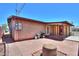 Cozy backyard patio with brick paving, barbeque and access to covered area offers relaxing outdoor enjoyment at 1109 N Walnut Dr, Casa Grande, AZ 85122