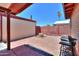 Enclosed backyard with vintage brick paved patio, grill and privacy fence at 1109 N Walnut Dr, Casa Grande, AZ 85122
