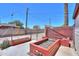 Backyard with outdoor garden beds, fully fenced perimeter, offering space for cultivating your own produce at 1109 N Walnut Dr, Casa Grande, AZ 85122