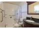Bathroom featuring accessible shower with grab bars, decorative vanity and tile flooring at 1109 N Walnut Dr, Casa Grande, AZ 85122