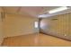 Finished bonus room offering laminate floors, neutral walls, and access to the backyard at 1109 N Walnut Dr, Casa Grande, AZ 85122