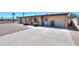 Single-story brick home with well-maintained concrete driveway and tidy landscaping at 1109 N Walnut Dr, Casa Grande, AZ 85122