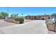 Well-kept single-story home featuring a long driveway and desert landscaping at 1109 N Walnut Dr, Casa Grande, AZ 85122