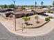 This corner lot property has low brick wall landscaping and mature trees at 1109 N Walnut Dr, Casa Grande, AZ 85122