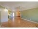 Open-concept living room with wood flooring and view to kitchen at 1109 N Walnut Dr, Casa Grande, AZ 85122
