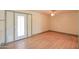 Bright living room features wood floors and natural light from the sliding glass door at 1109 N Walnut Dr, Casa Grande, AZ 85122