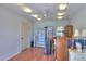 Spacious living room with wood flooring and multiple lamps and furniture at 1109 N Walnut Dr, Casa Grande, AZ 85122