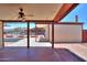 Covered patio with a ceiling fan overlooking a spacious backyard with a car port at 1109 N Walnut Dr, Casa Grande, AZ 85122