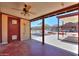 The covered patio features an outdoor ceiling fan and views of the backyard and carport at 1109 N Walnut Dr, Casa Grande, AZ 85122
