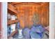 Inside a wooden shed showing various tools and household items on shelves and on the floor at 1109 N Walnut Dr, Casa Grande, AZ 85122