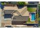 Aerial view of a well-maintained home with large roof and pool in the backyard at 1506 E Branham Ln, Phoenix, AZ 85042