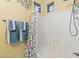 Shower and bathtub combination with butterfly-themed shower curtain and stylish fixtures at 1506 E Branham Ln, Phoenix, AZ 85042