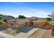 Charming single-story home boasts desert landscaping, tile roof, and multiple car garage at 1506 E Branham Ln, Phoenix, AZ 85042