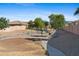 Community playground with swings and slides surrounded by desert landscaping at 1506 E Branham Ln, Phoenix, AZ 85042
