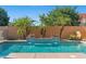 Beautiful private pool area, complemented by lush landscaping and a soothing water feature, ideal for relaxation at 1506 E Branham Ln, Phoenix, AZ 85042