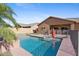 Sparkling private pool surrounded by lush landscaping, offering a serene backyard oasis at 1506 E Branham Ln, Phoenix, AZ 85042
