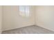This bedroom features neutral-colored walls, carpet, and a window, creating a calm and serene space at 1515 E South Fork Dr, Phoenix, AZ 85048