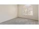 Bright bedroom with a unique window offering natural light and view at 1515 E South Fork Dr, Phoenix, AZ 85048