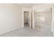 Comfortable bedroom with a large mirrored closet and an adjacent room at 1515 E South Fork Dr, Phoenix, AZ 85048