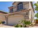 The two-story home features a neutral exterior, a well-manicured yard, and a two-car garage at 1515 E South Fork Dr, Phoenix, AZ 85048