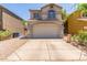 The two-story home features a neutral exterior, a well-manicured yard, and a two-car garage at 1515 E South Fork Dr, Phoenix, AZ 85048