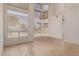 Bright living room boasting high ceilings, large windows and neutral tile flooring, creating an open and airy atmosphere at 1515 E South Fork Dr, Phoenix, AZ 85048