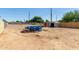 Spacious backyard with an above-ground pool and two storage sheds for outdoor equipment at 1527 W Roma Ave, Phoenix, AZ 85015