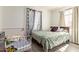 Neutral bedroom with a bed and a large patterned curtain at 1527 W Roma Ave, Phoenix, AZ 85015