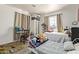 Bedroom with two beds and a large window letting in natural light at 1527 W Roma Ave, Phoenix, AZ 85015