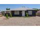 Charming single-story home featuring a freshly painted exterior and well-maintained front yard at 1527 W Roma Ave, Phoenix, AZ 85015