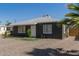 Picture of the home's front entrance with minimal, low-water landscaping at 1527 W Roma Ave, Phoenix, AZ 85015