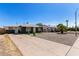 Single-Gathering home featuring a concrete driveway and low maintenance desert landscaping at 1527 W Roma Ave, Phoenix, AZ 85015