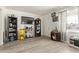 Bright living room featuring wood laminate flooring, neutral paint, and large window at 1527 W Roma Ave, Phoenix, AZ 85015