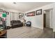 Spacious living room featuring laminate flooring, light walls, and large window at 1527 W Roma Ave, Phoenix, AZ 85015