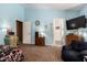 Spacious bedroom with neutral carpet features doorways and ample space for comfortable living at 16833 N 113Th Ave, Surprise, AZ 85378