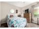 Comfortable bedroom featuring neutral walls, soft carpet, and a cozy bed at 16833 N 113Th Ave, Surprise, AZ 85378