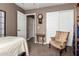 Comfortable bedroom with neutral carpet features closet and ample space for relaxation at 16833 N 113Th Ave, Surprise, AZ 85378