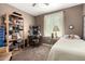 This bedroom can easily be used as a home office, as it features a desk, shelf and bed at 16833 N 113Th Ave, Surprise, AZ 85378