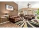 Inviting living room featuring comfortable seating, stylish decor, and an open layout at 16833 N 113Th Ave, Surprise, AZ 85378