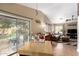 Open-concept home featuring a connected living room and dining area with seamless access to the outdoors at 16833 N 113Th Ave, Surprise, AZ 85378