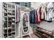 Well-organized walk-in closet provides ample storage and easy access to clothing and shoes at 16833 N 113Th Ave, Surprise, AZ 85378