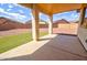 Covered back patio overlooking a landscaped yard, perfect for outdoor entertaining at 1789 E Desert Breeze Pl, Casa Grande, AZ 85122