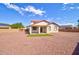 Spacious backyard with low maintenance landscaping and a covered patio, perfect for relaxation at 1789 E Desert Breeze Pl, Casa Grande, AZ 85122