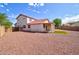 Expansive backyard features low-maintenance landscaping, offering privacy and space for outdoor activities at 1789 E Desert Breeze Pl, Casa Grande, AZ 85122