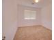 Inviting bedroom features neutral walls, plush carpet, and a window for natural light at 1789 E Desert Breeze Pl, Casa Grande, AZ 85122