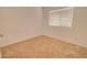 Bedroom featuring neutral carpet, a window and neutral walls at 1789 E Desert Breeze Pl, Casa Grande, AZ 85122
