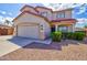 Two-story home with a well-manicured front yard and a welcoming covered porch at 1789 E Desert Breeze Pl, Casa Grande, AZ 85122